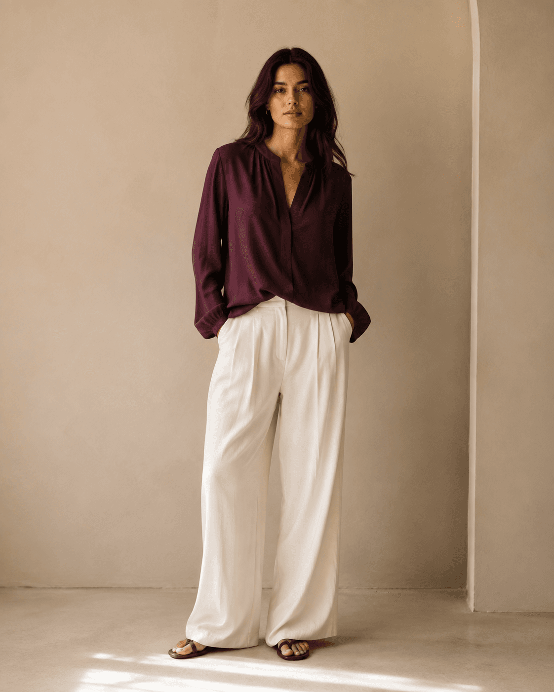 Aubergine blouse with fluid cream trousers